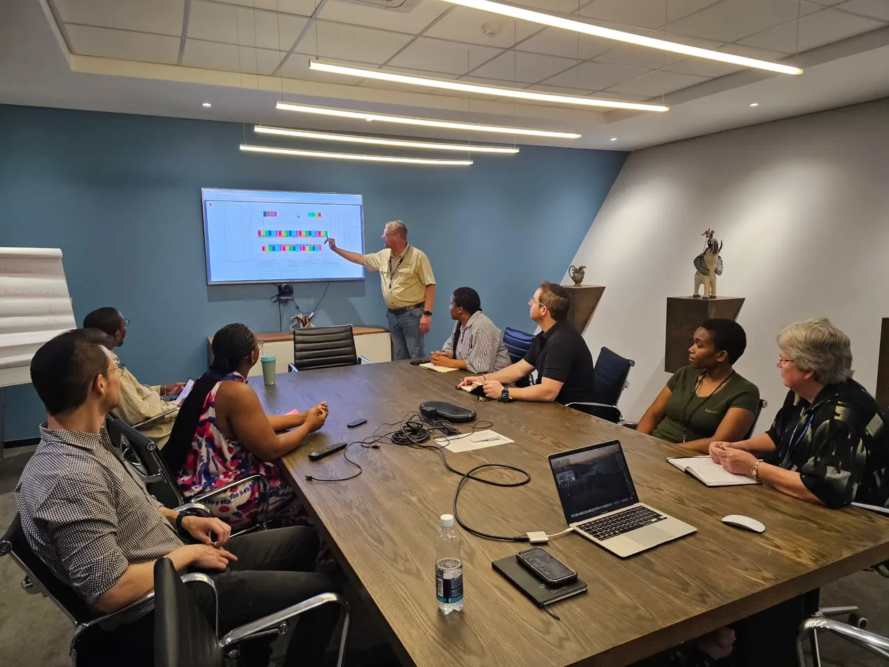 The GreenMatters team around the boardroom table during a design review