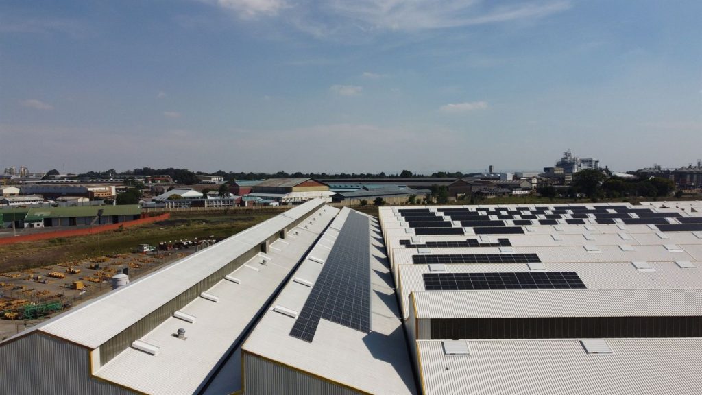 A long run of solar panels along a roof at Barloworld Boksburg